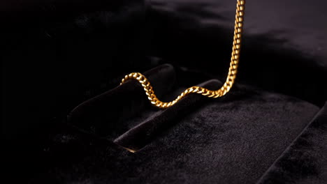 golden chain on black velvet