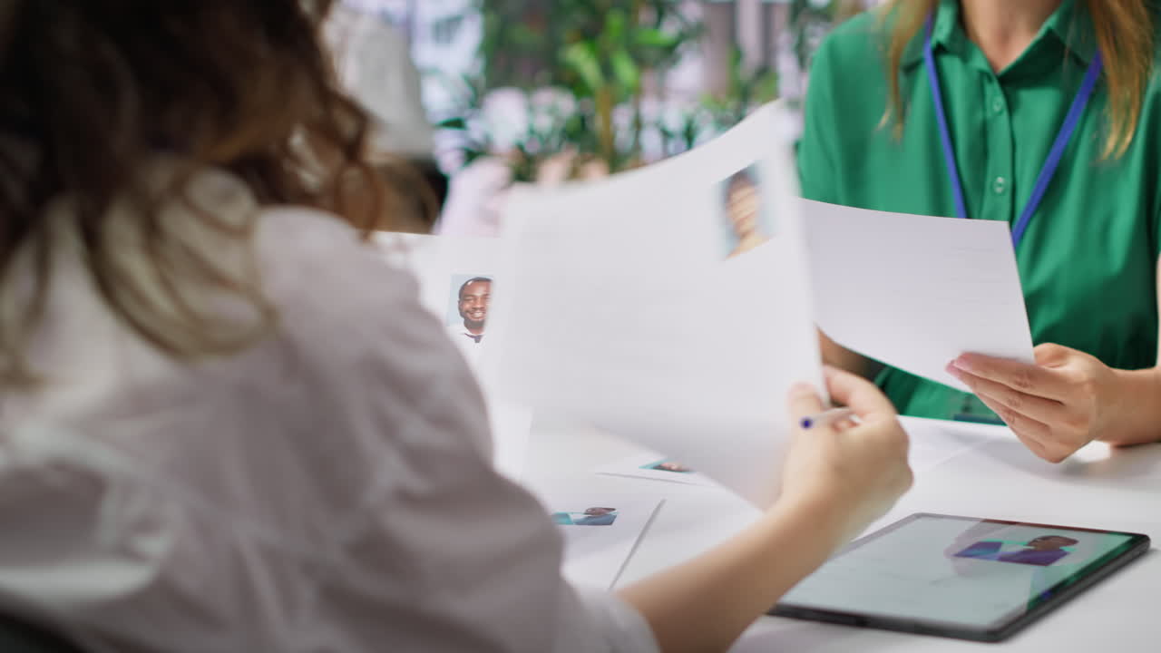 Human resources staff evaluating candidates resume in the selection process