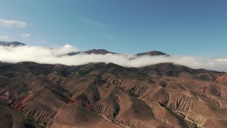high aerial view, beautiful cloudy mountains near the route 9 in the province of jujuy in argentina, copy space and slow motion, high view with copy space