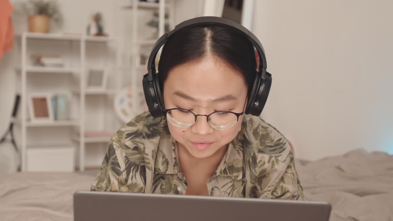 Asian Zoomer Teen Girl with Laptop at Home