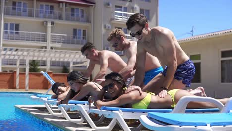 women receiving massage from their boyfriends at a beautiful villa by the pool