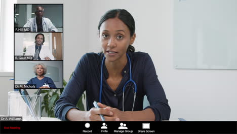 young female doctor gives good news during video meeting