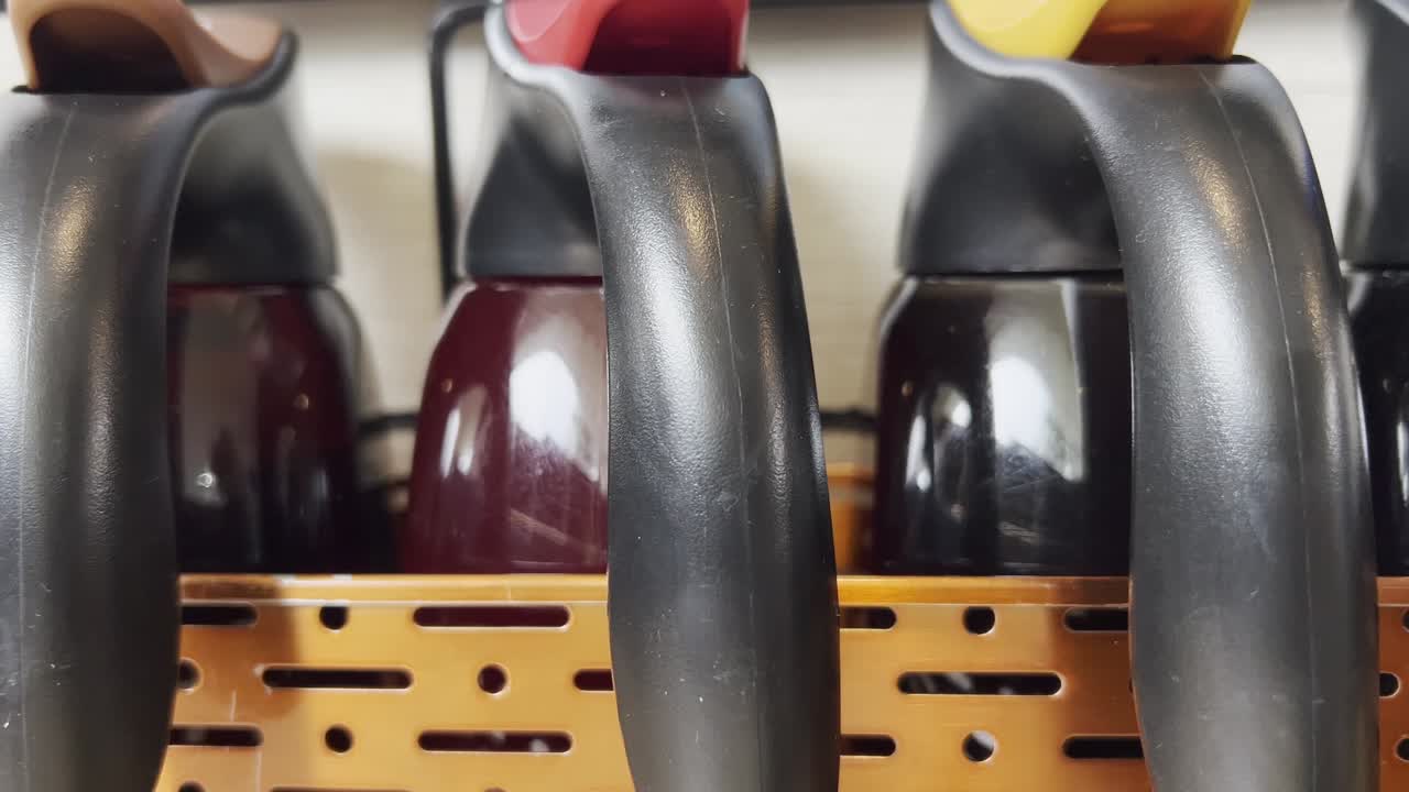 Several thermal carafes containing hot beverages are arranged in a self-service area, ready to dispense coffee, tea, or other warm drinks to guests in Mexico