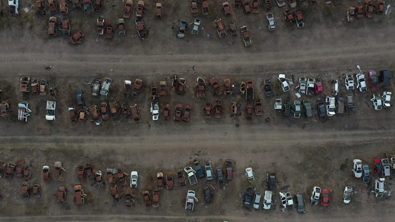 Bottom up aerial cenital shot  from a abandonated car junk