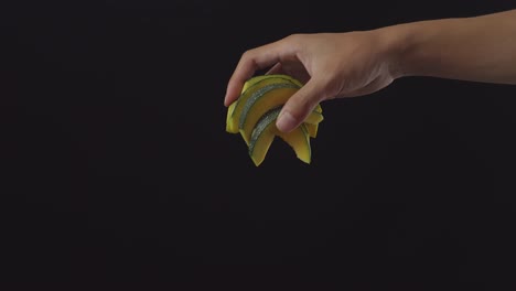 hand holding sliced pumpkin