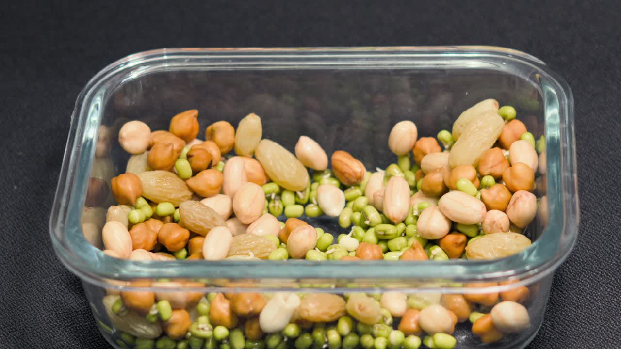 taking soak sprouts and nuts to eat closeup view