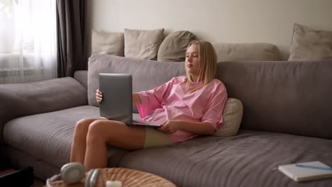 young woman working from home on laptop