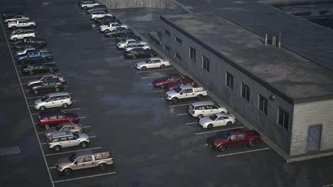 aerial view of a parking lot with cars