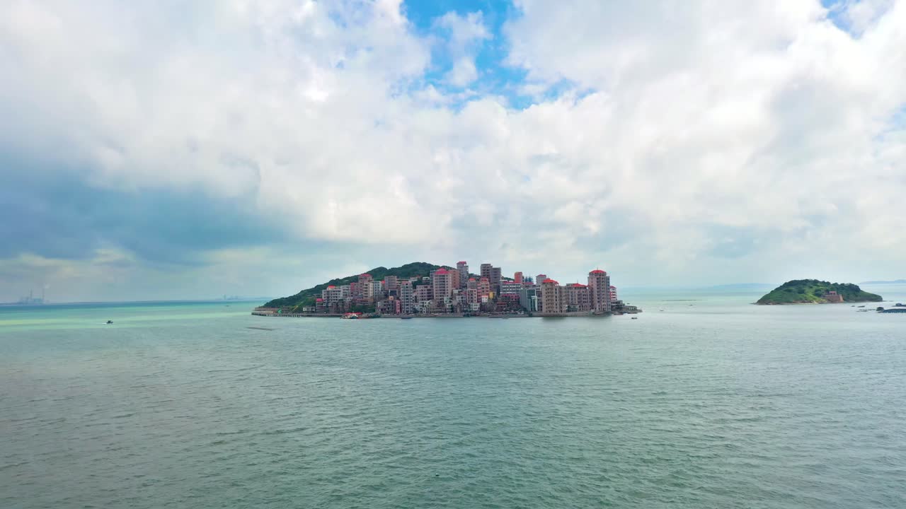 Aerial View of Island Town in Calm Ocean