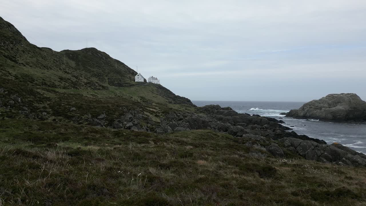 Still Video of Kr&aring;kenes Lighthouse at a Far Distance on a Windy and Moody Day