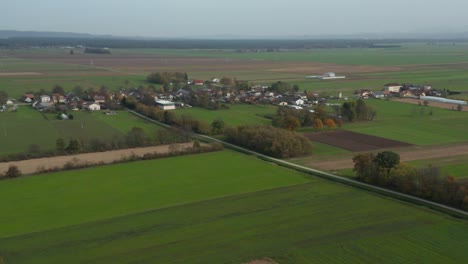 Aerial-view-of-Podova,-a-rural-village-in-eastern-Slovenia,-south-of-the-city-Maribor-in-the-Pannonian-flatlands,-Drava-river-plain