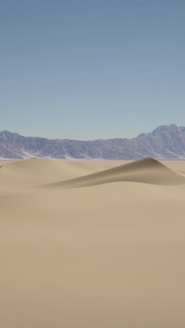 desert landscape with sand dunes and mountains