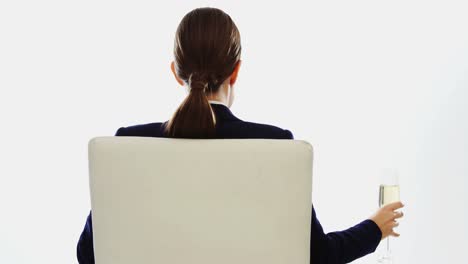 Businesswoman-having-a-glass-of-wine