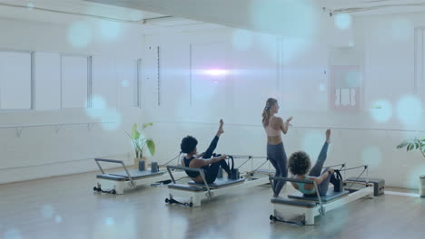 guiding participants in exercise class, instructor leading fitness routine in bright studio