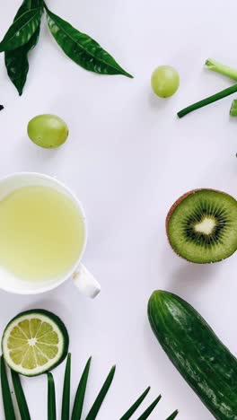 healthy green detox drink with fruits and tea