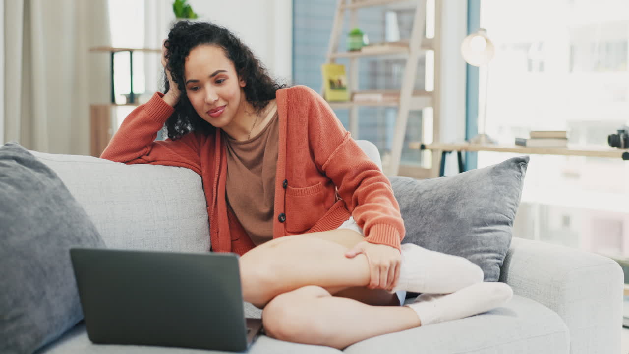 Woman relax on sofa, watch on laptop and happy