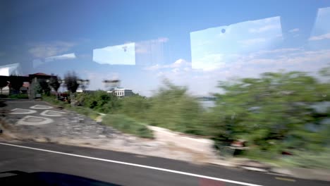 rolling hills and greenery along the route from ankara to konya, as seen from the bus window.