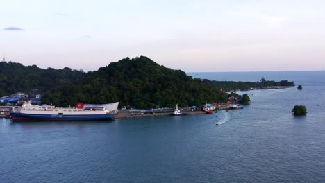 port of balikpapan with oil tanker moored in kalimantan, indonesia - aerial drone shot