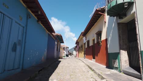 vivid la candelaria street with cobblestones, bogotá colombia