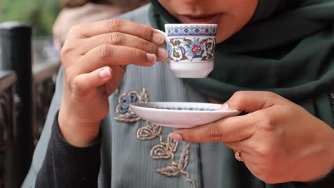 woman drinking turkish coffee