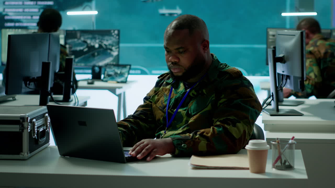 Intelligence agents in modern operations center managing surveillance activity