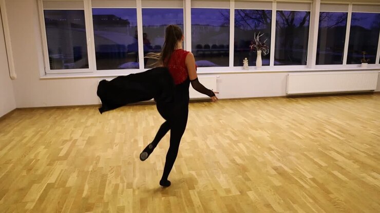 Slow motion professional female dancer performing on the dance floor