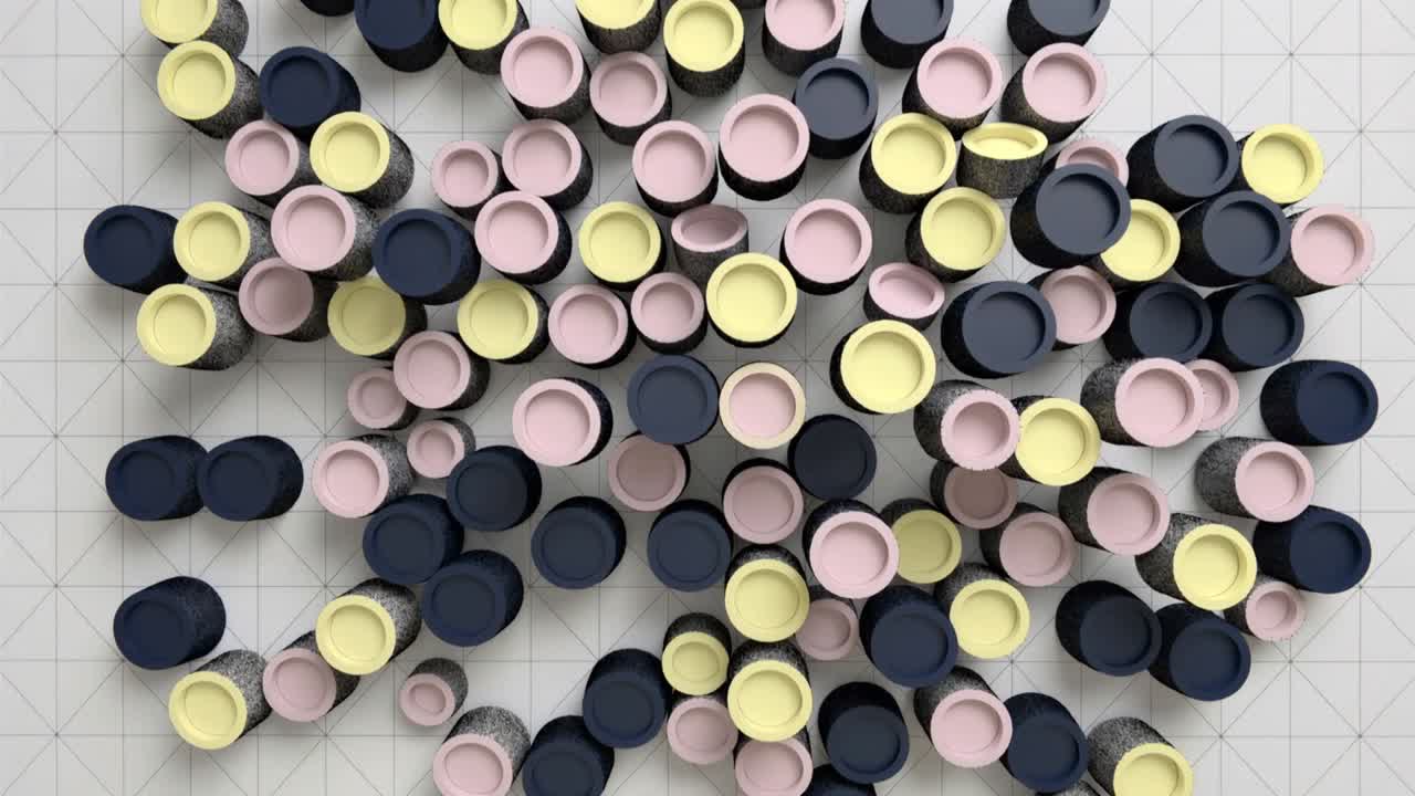 Grappolo di pilastri compatti in movimento che risponde all'avanzamento del fotogramma su un tappetino grigio, mostrando cime blu scuro, rosa e gialle.