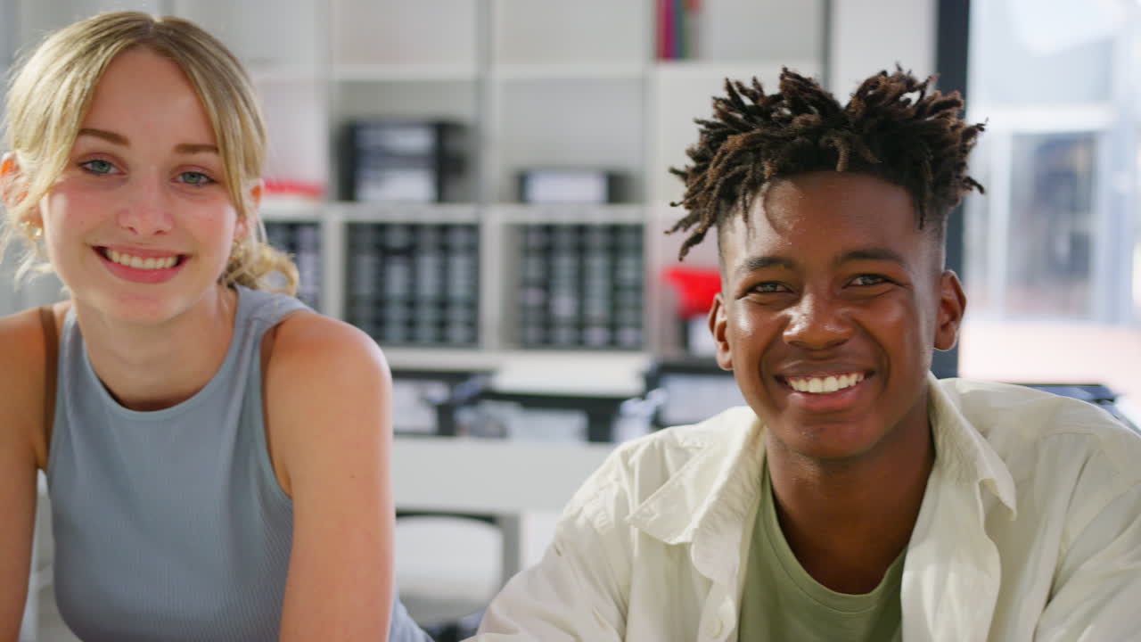 Close Up Portrait Of Smiling Multi-Cultural High School Or Secondary Pupils In Class