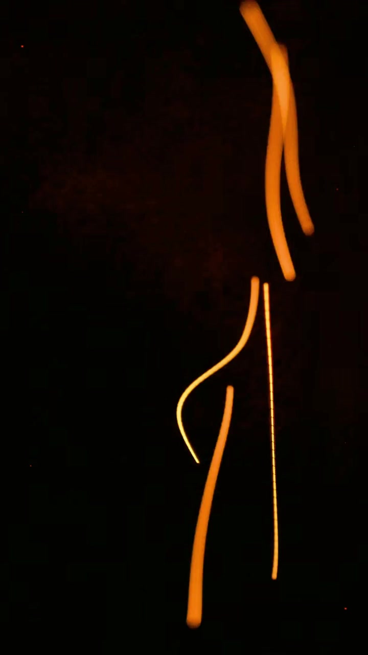 Abstract Light Streaks Moving Against a Dark Background