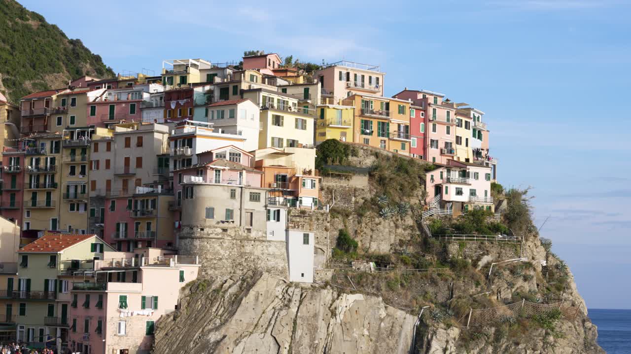 Colorful hillside buildings of Manarola Cinque Terre, Italy with a serene vibe