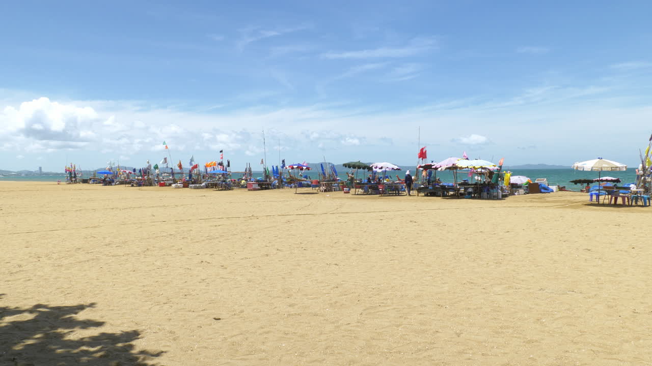 Fishermen are sorting out their fishing gear such as nets, ice boxes, buoys, as they prepare to go fishing while some are preparing some dishes with their fresh catch in Pattaya Beach, Thailand