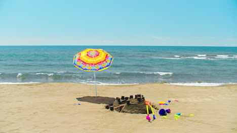 beach day fun with sandcastle and umbrella