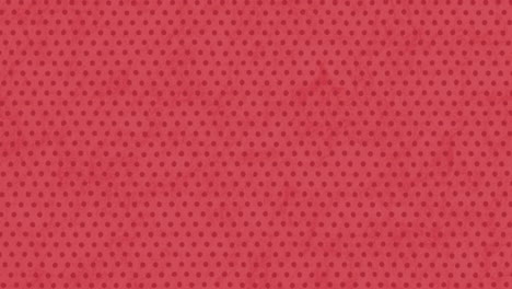 filas de puntos que se mueven contra un fondo rojo