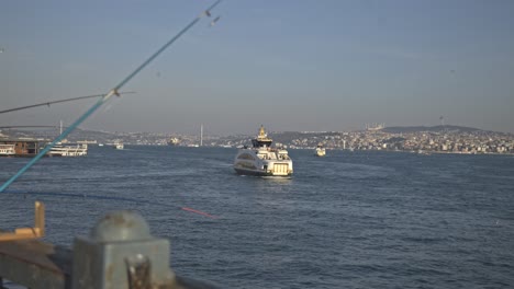 fishermen fishing on the bosphorus, galata bridge, with a sea view