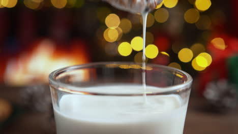 dipping a cookie into milk during the holidays