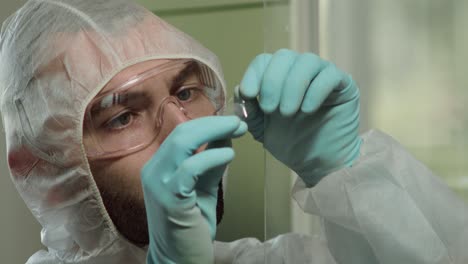 collecting fingerprints from glass surface, crime scene investigation, face middle shot