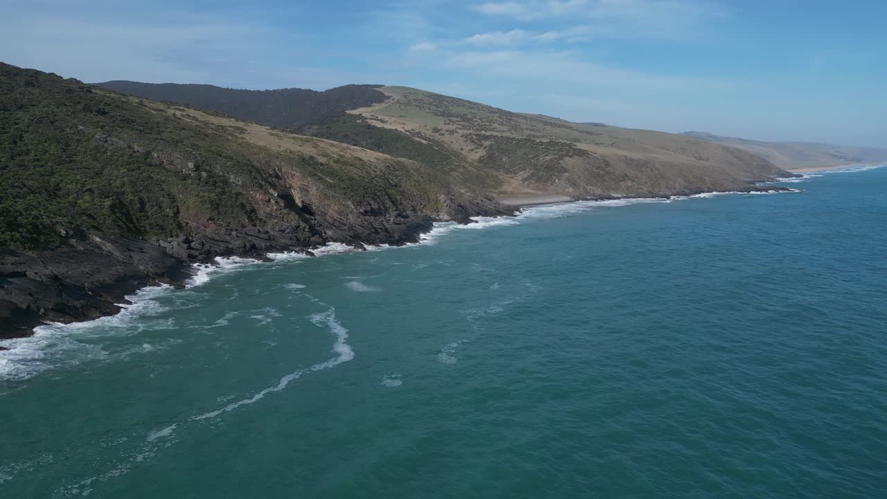Aerial wide shot showing coastline of Kangaroo Island with clear ocean water in Southern Australia