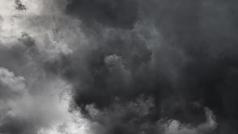 Lightning-bolt-strikes-and-dark-clouds-in-dark-sky