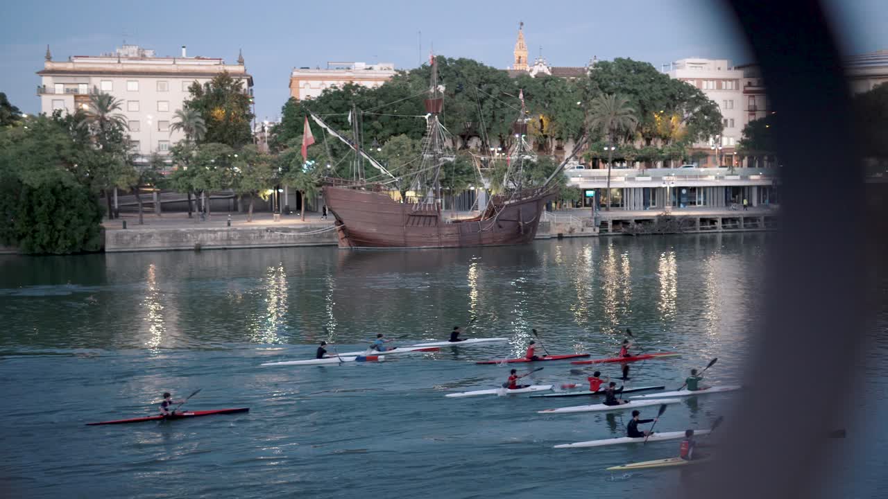 Board Pitara water sports canoeing in the city river, kayaking in seville in very calm blue waters. Spain and Andalusia with sports tourism