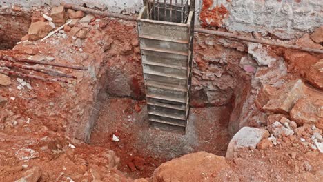 top view of curing water on footing layout at construction site. day time, tilt down shot, 4k