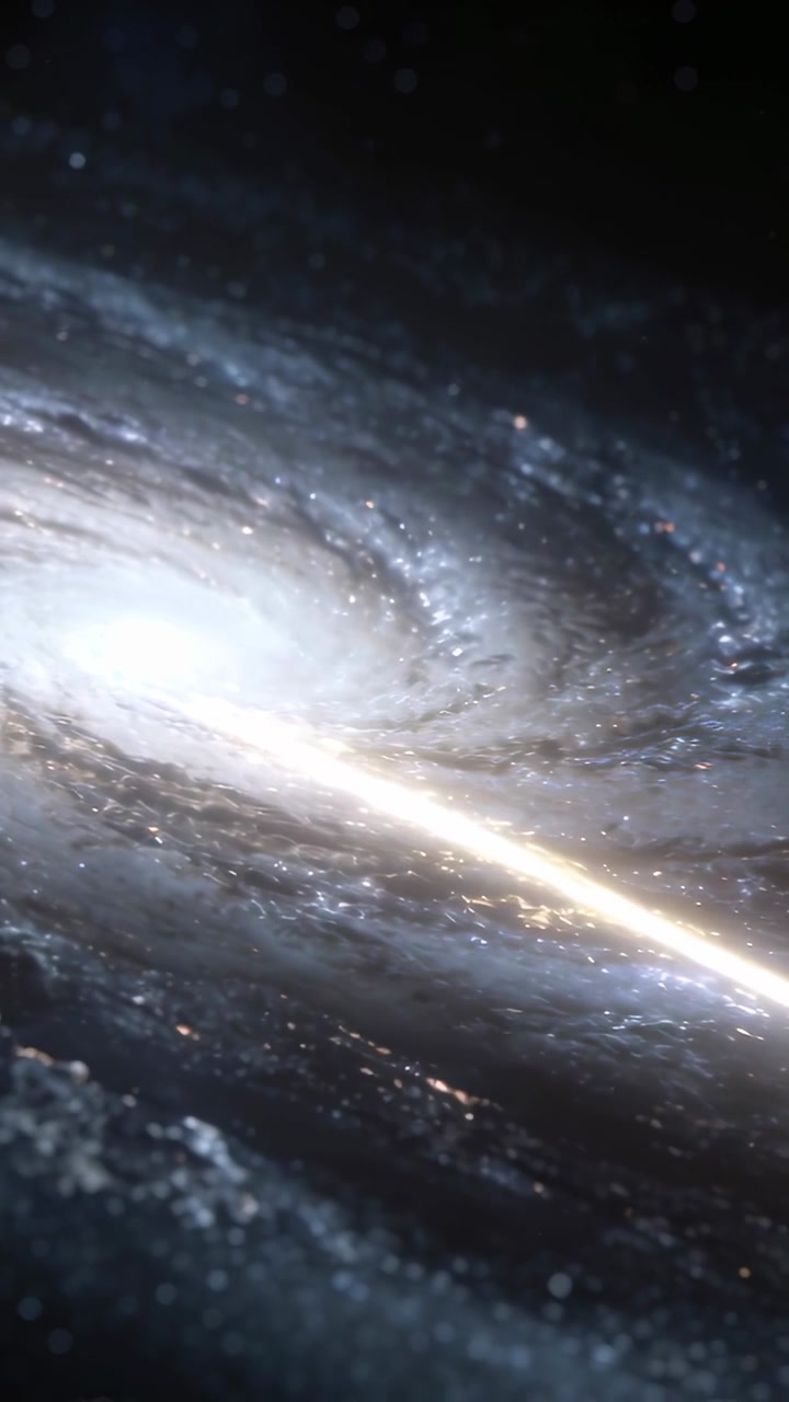 Vertical video: Panning camera revealing spiral galaxy from deep space, showing outer arms and band