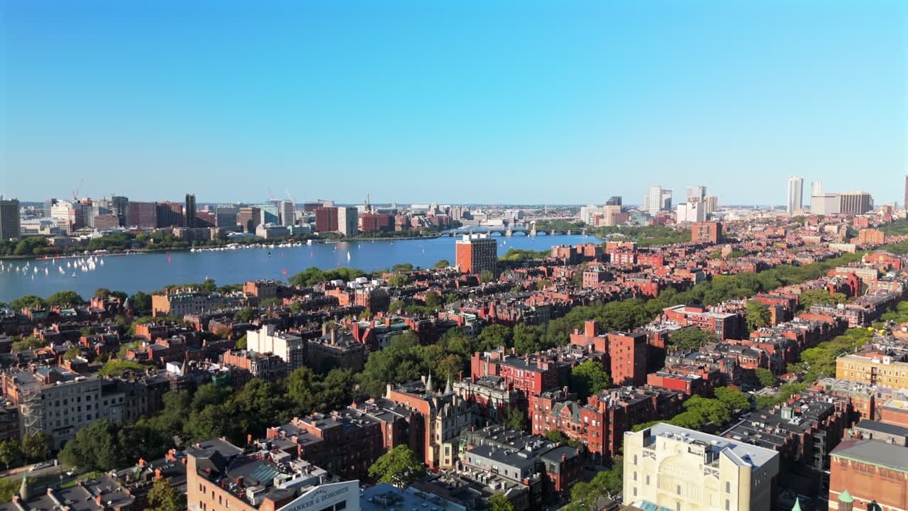 High angle shot showing Back Bay East neighborhood and Charles River under clear blue sky