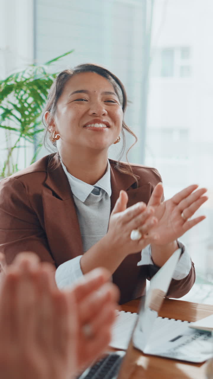 Happy Businesswoman Clapping and Smiling During a Meeting