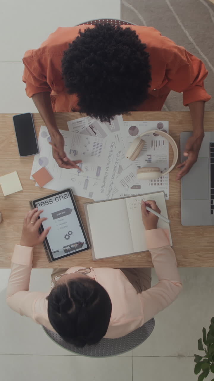 Businesspeople Meeting at Office to Discuss Work at Table Top View
