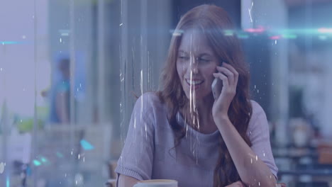 woman talking smartphone in modern café, displaying animated chat bubbles and tech icons