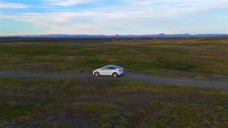 witness the beauty of solitude as a home stands resilient on iceland’s aged lava fields from above.