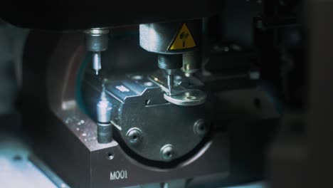 A key being engraved by a machine