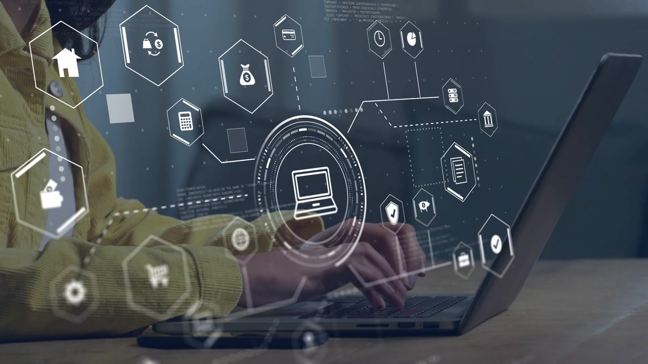 Woman holding phone over laptop and typing, tapping causing expanding hex UI for finance