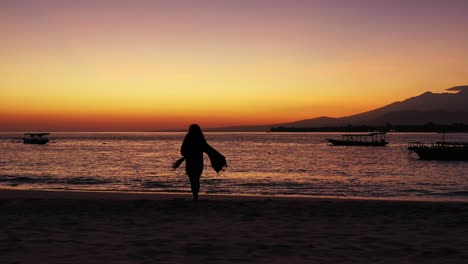 Young-Traveler-Standing-on-The-Tropical-sandy-beach-On-Golden-Hour,-waiting-to-see-the-sunset,-Seychelles,-Victoria