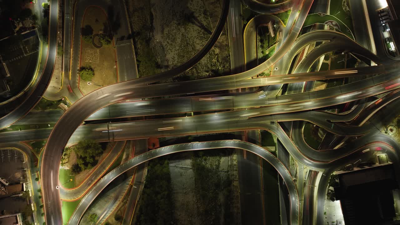 Top down Hyperlapse drone shot above traffic on a intersection, night in Mexico